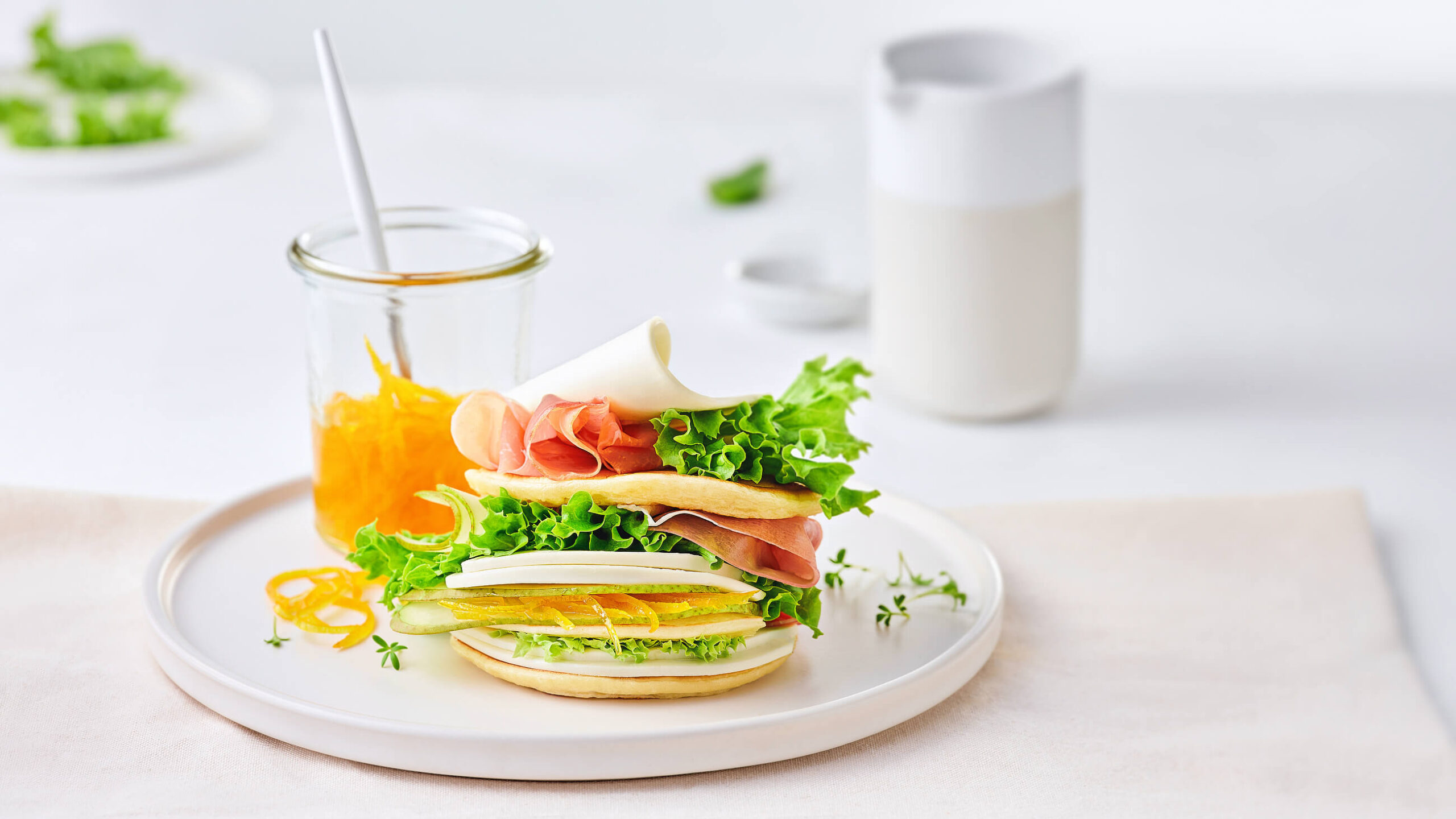 pancake sandwich with cream cheese ham and orange jam — recipe food photography Minsk